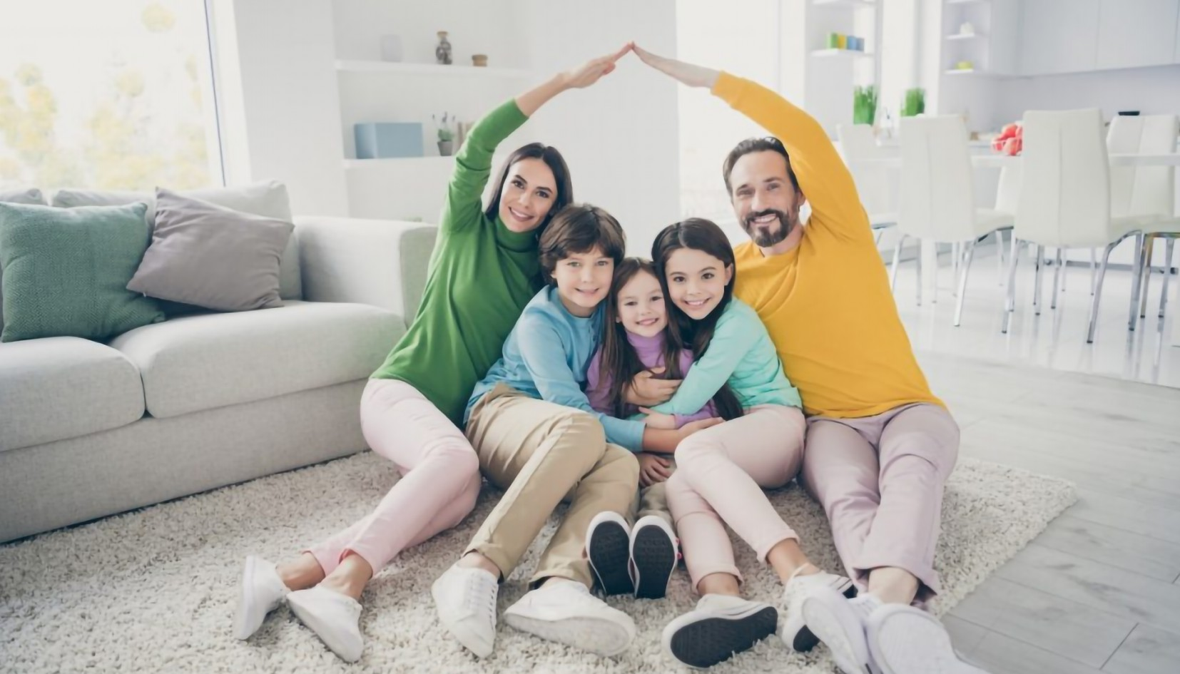 A family together in a clean, bright living room